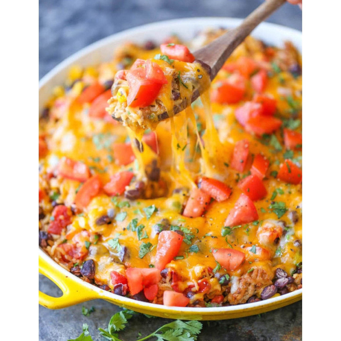 Cheesy Mexican skillet meal with colorful vegetables, tender meat, rice and melted cheese.
