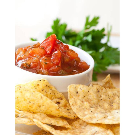 Tortilla chips and salsa on a plate - a delicious Mexican snack with crispy chips.