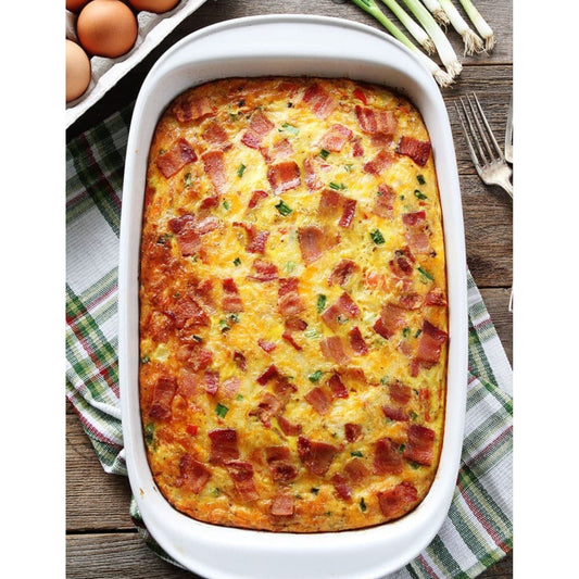 Bacon and cheese casserole in a baking dish, golden and bubbly, ready to be served for a delicious meal.