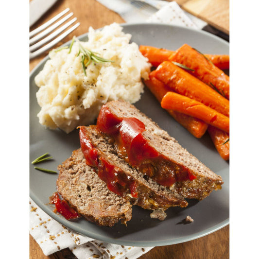Classic comfort food: meatloaf with traditional red sauce, mashed potatoes and carrots.
