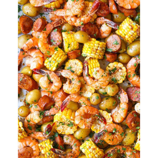 A sheet pan filled with shrimp, corn, potatoes, and vegetables, roasted to perfection. Low Country Boil without the mess of boiling.