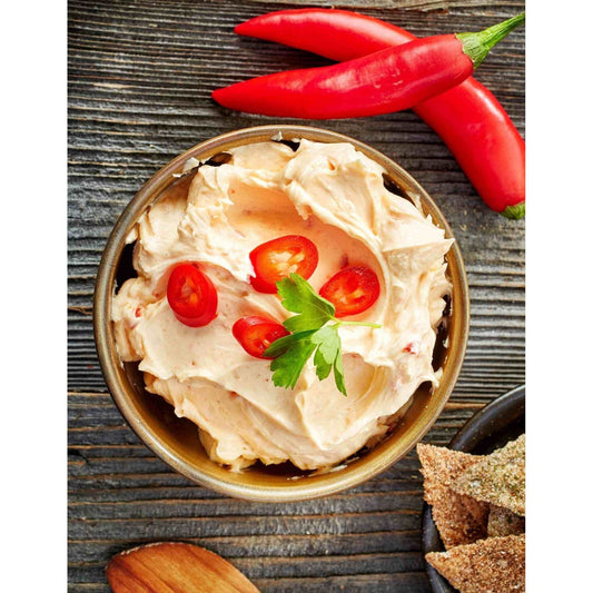 A delicious mexican dip with red peppers served with crackers.