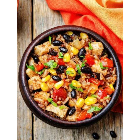 Southwest Mexican chicken and rice skillet dish with corn and beans in a bowl.