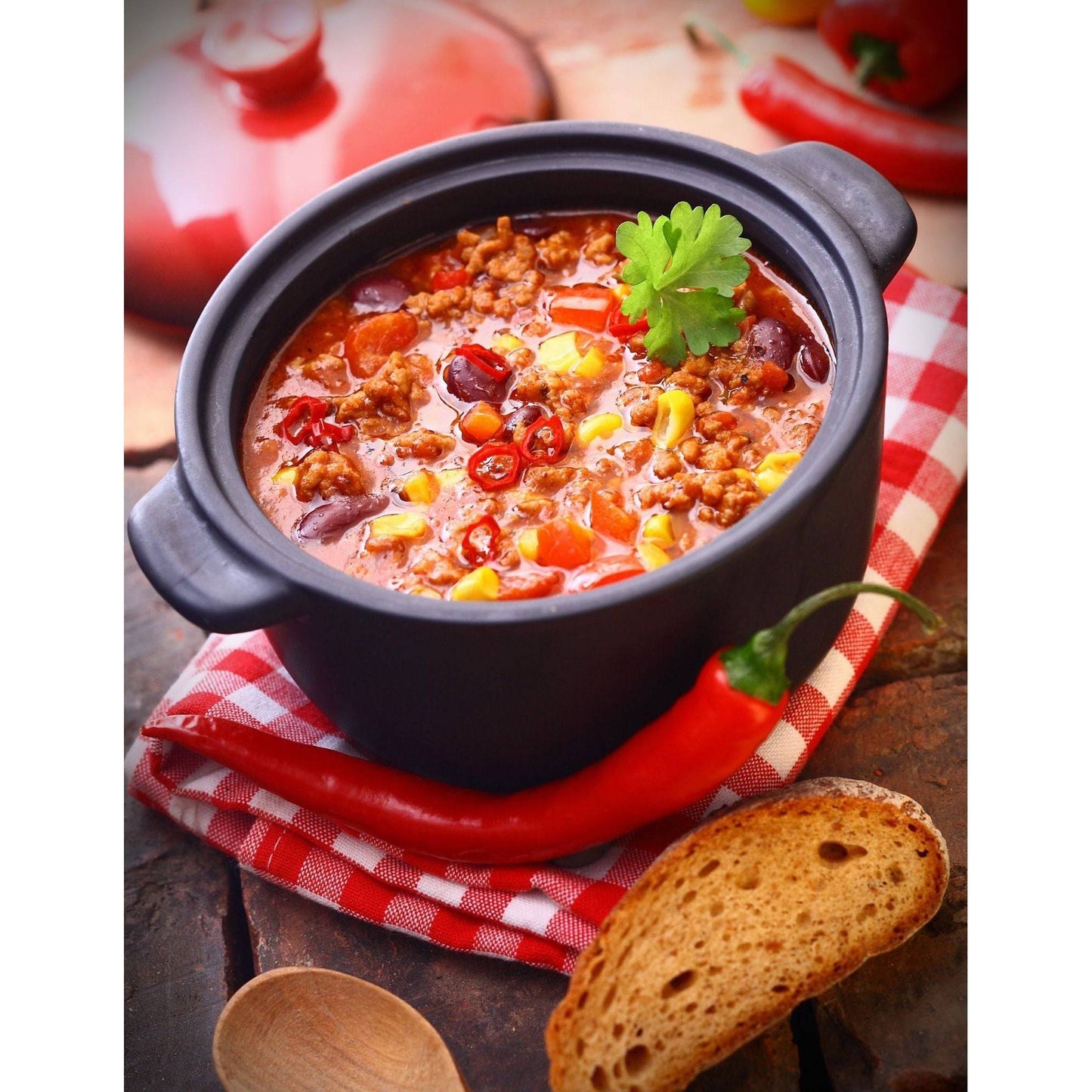 A bowl of delicious taco soup. Top with shredded cheese, sour cream, and fresh cilantro for a special treat.